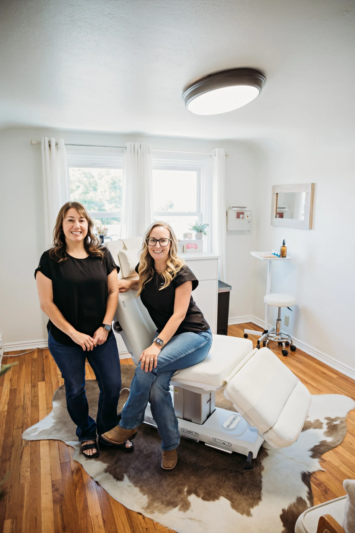 Cheri and Cassie welcoming patients into their studio